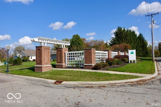 view of property's community with a yard