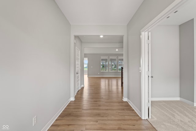 hall with light hardwood / wood-style floors