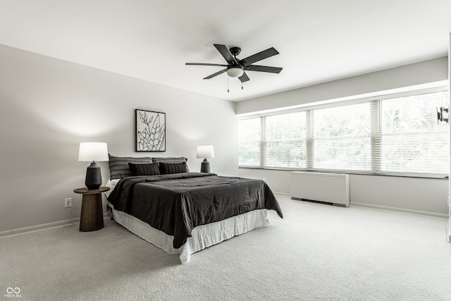 bedroom featuring ceiling fan and light colored carpet