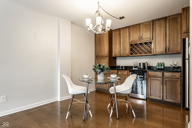 kitchen featuring dark hardwood / wood-style flooring, a notable chandelier, hanging light fixtures, and wine cooler