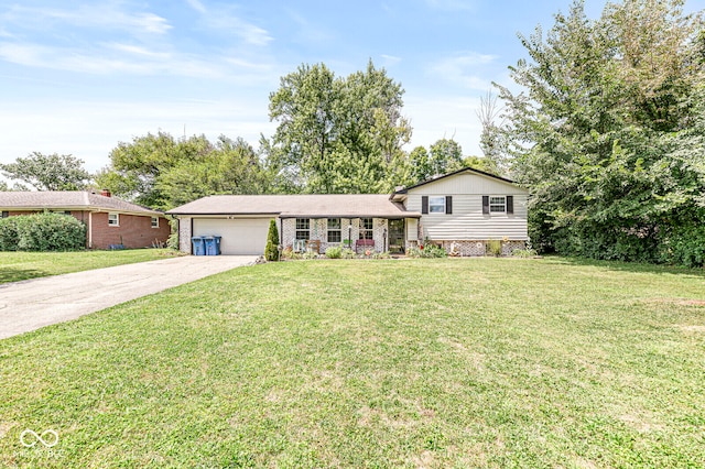 split level home with a front yard and a garage