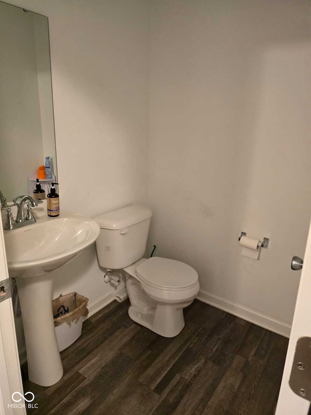 bathroom featuring toilet and hardwood / wood-style flooring