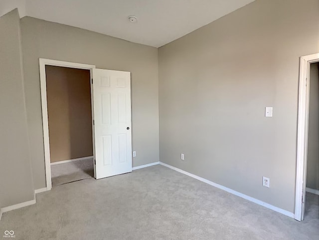 unfurnished bedroom with light carpet