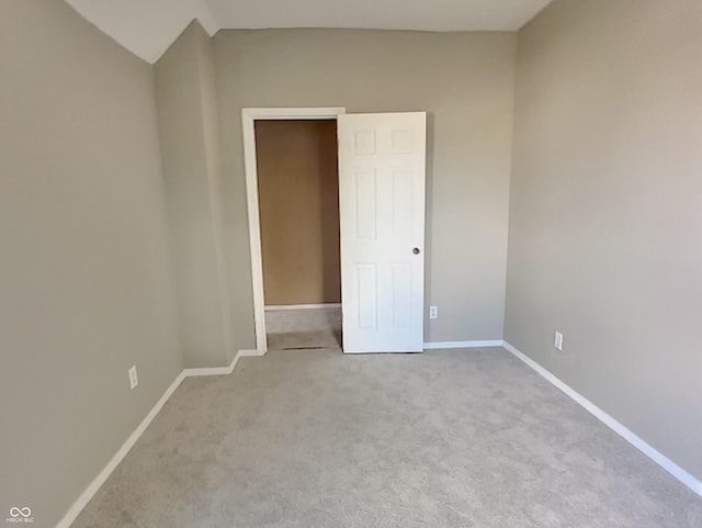 unfurnished bedroom with light colored carpet