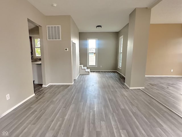 interior space featuring light hardwood / wood-style floors and a healthy amount of sunlight