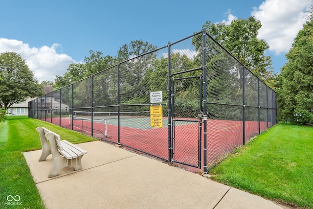 view of sport court featuring a yard