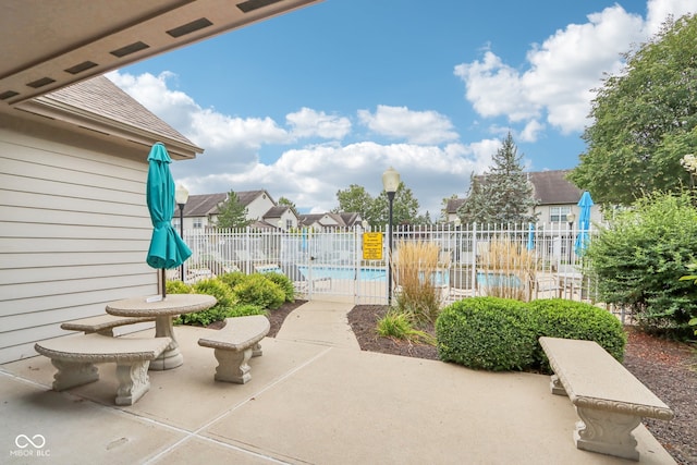 view of patio / terrace featuring a community pool