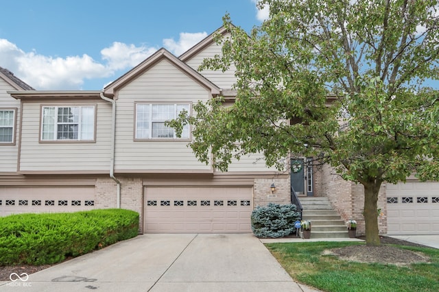 townhome / multi-family property featuring a garage