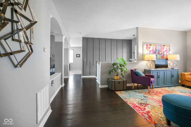 living room with dark hardwood / wood-style floors