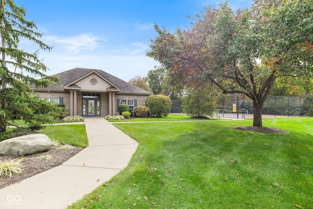 view of property's community featuring a lawn