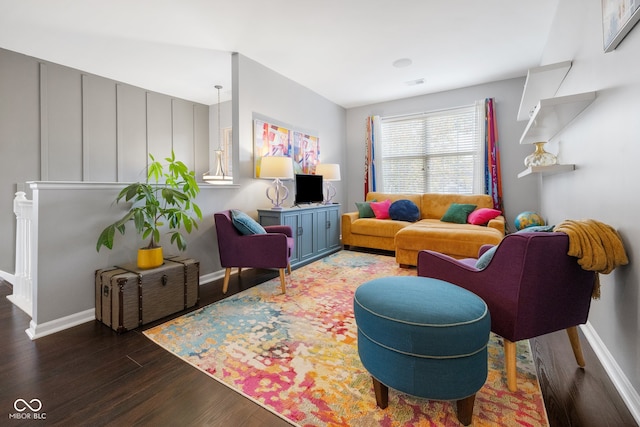 living room with dark hardwood / wood-style flooring