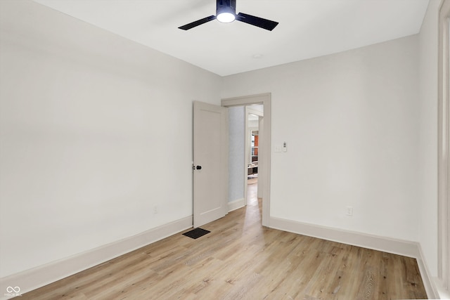 empty room with light hardwood / wood-style flooring and ceiling fan