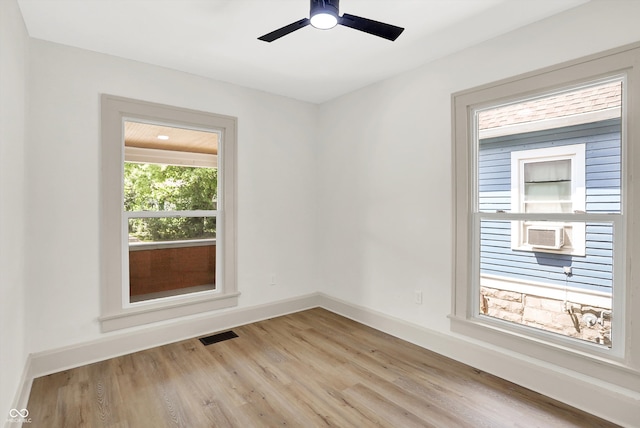 unfurnished room featuring ceiling fan and light hardwood / wood-style floors