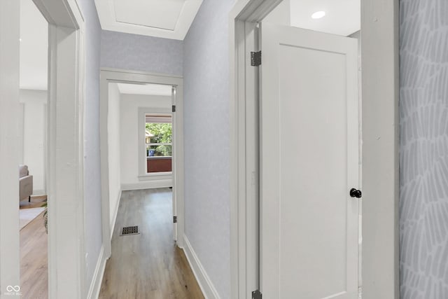 corridor with light wood-type flooring