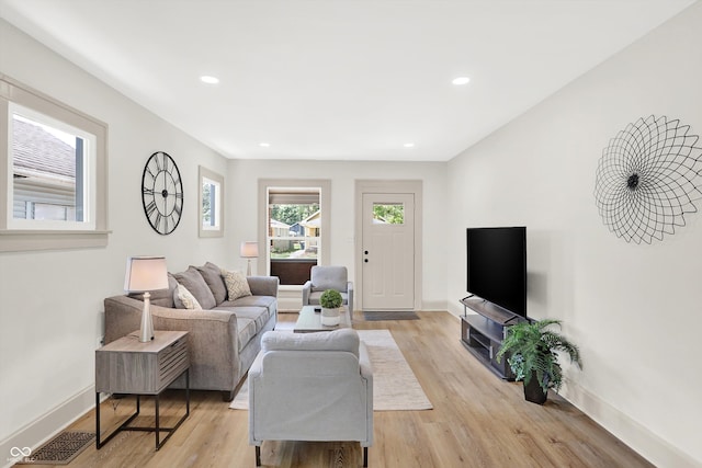 living room with light hardwood / wood-style floors