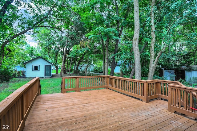 wooden terrace with a storage shed