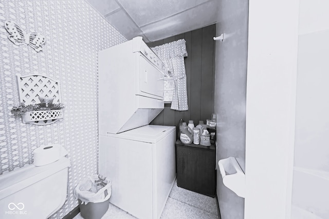 laundry room featuring stacked washer and dryer