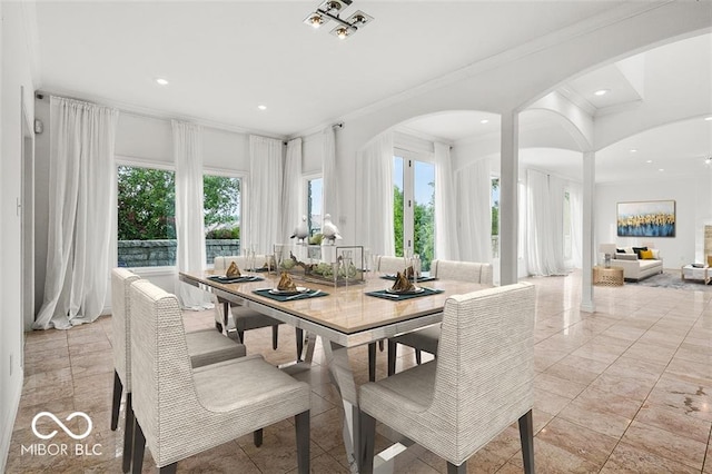 dining space with crown molding