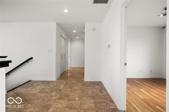 hallway with wood-type flooring