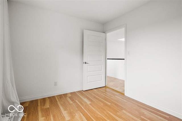 empty room featuring wood-type flooring