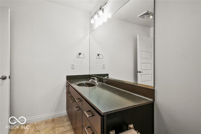 bathroom with vanity and tile patterned flooring