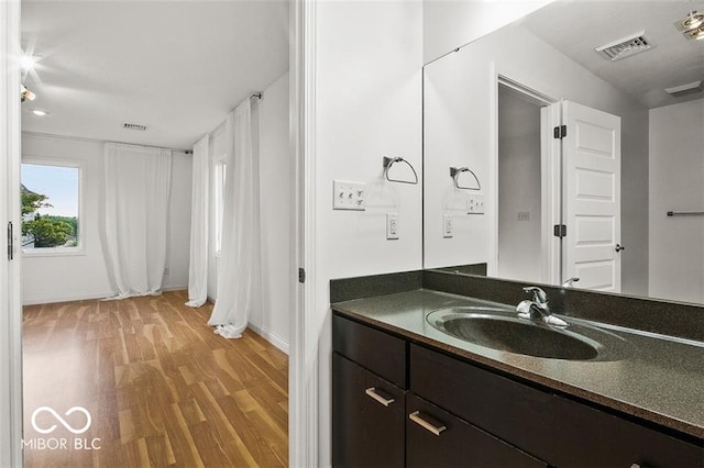 bathroom featuring vanity and hardwood / wood-style floors