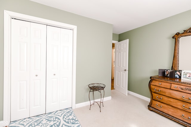 carpeted bedroom with a closet