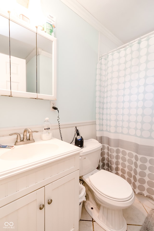 bathroom featuring crown molding, tile patterned floors, vanity, and toilet