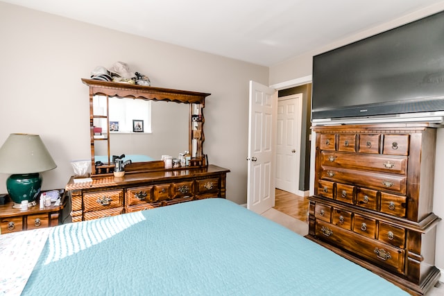 bedroom with light hardwood / wood-style floors