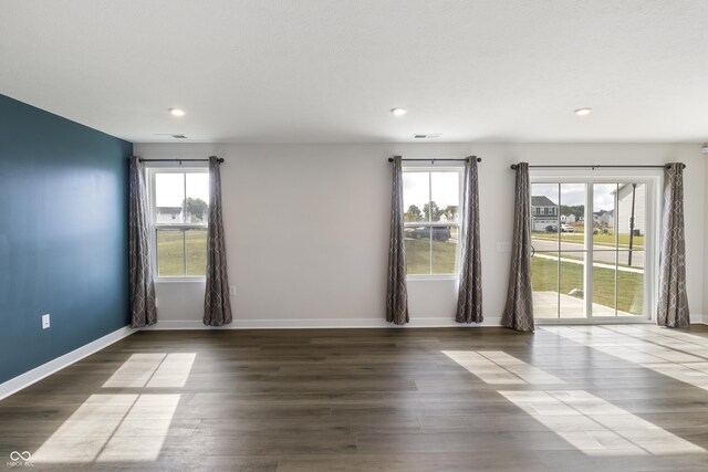 spare room featuring hardwood / wood-style flooring