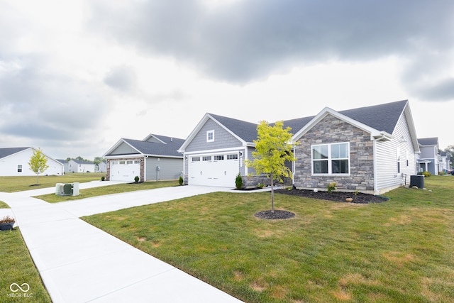 view of front facade featuring central AC unit, a garage, and a front yard