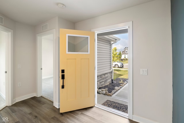 foyer entrance with hardwood / wood-style flooring