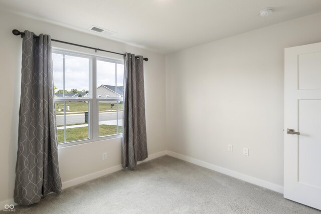 spare room with carpet flooring