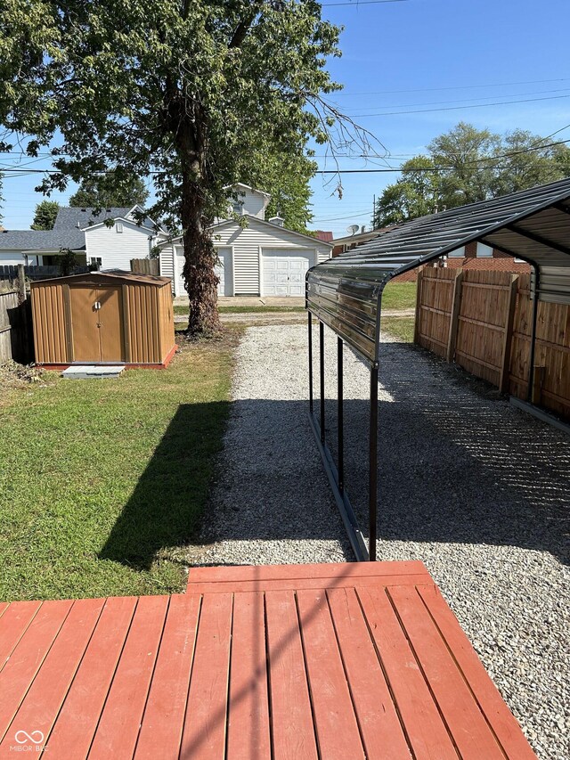 view of yard with a shed and a carport