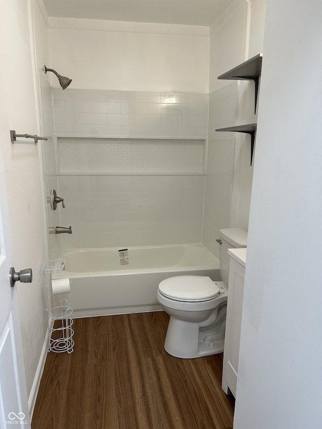 full bathroom with toilet, vanity, shower / bathtub combination, and hardwood / wood-style flooring