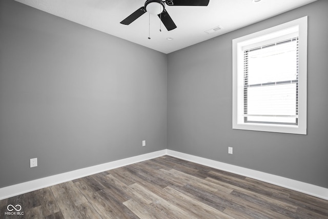 unfurnished room with ceiling fan and hardwood / wood-style flooring