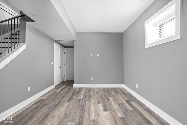 basement featuring hardwood / wood-style flooring