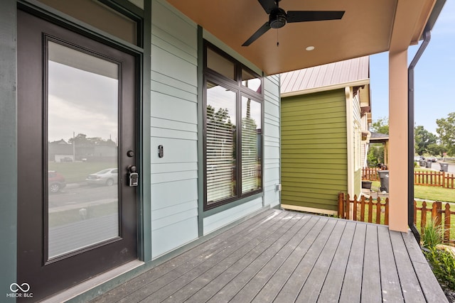 wooden terrace featuring ceiling fan