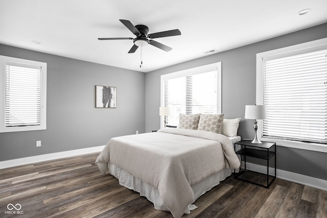 bedroom with dark wood-type flooring and ceiling fan