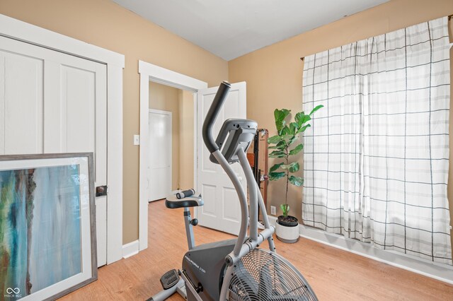 workout area featuring light wood-type flooring