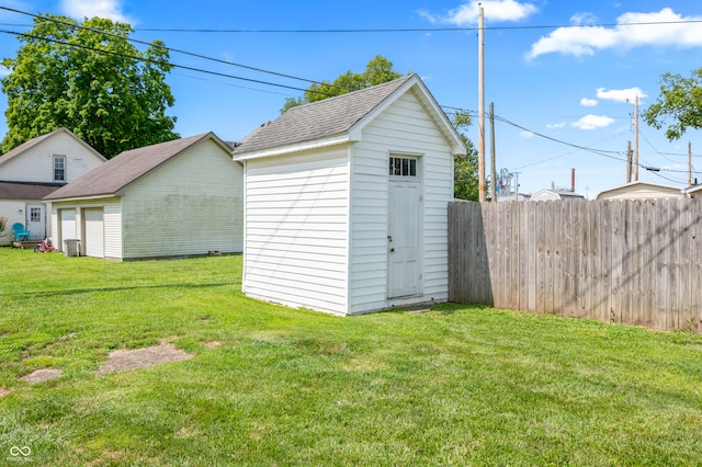 view of outbuilding featuring a lawn