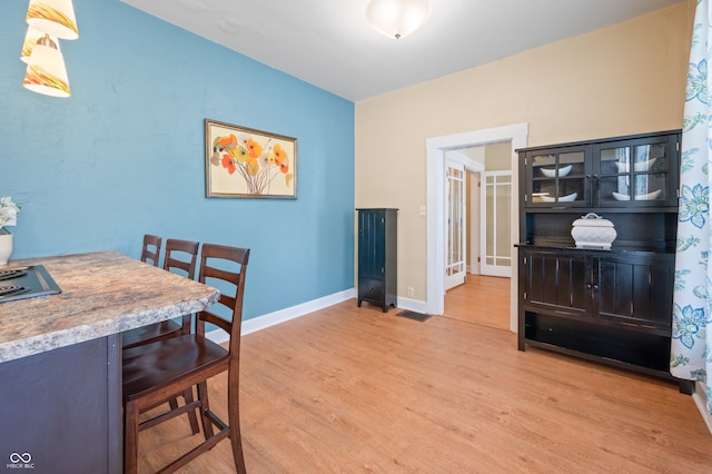 dining area with wood-type flooring