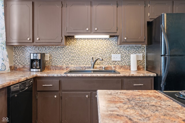 kitchen featuring dishwasher, decorative backsplash, refrigerator, sink, and gray cabinetry