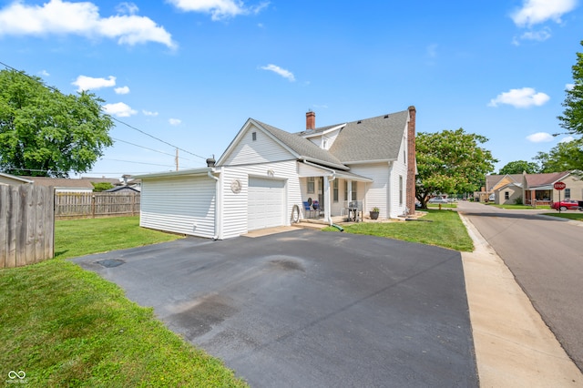 view of front of home featuring a garage and a front yard