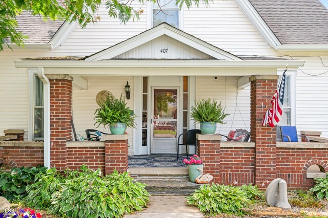 doorway to property featuring covered porch