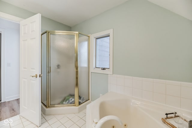 bathroom with wood-type flooring and separate shower and tub