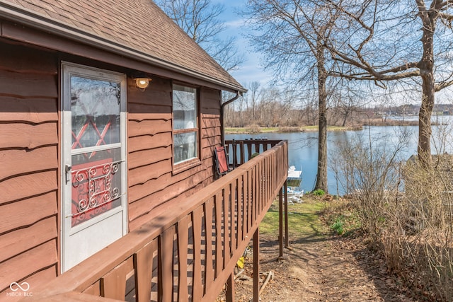 wooden terrace with a water view