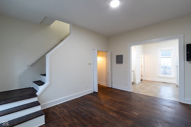 additional living space featuring wood-type flooring