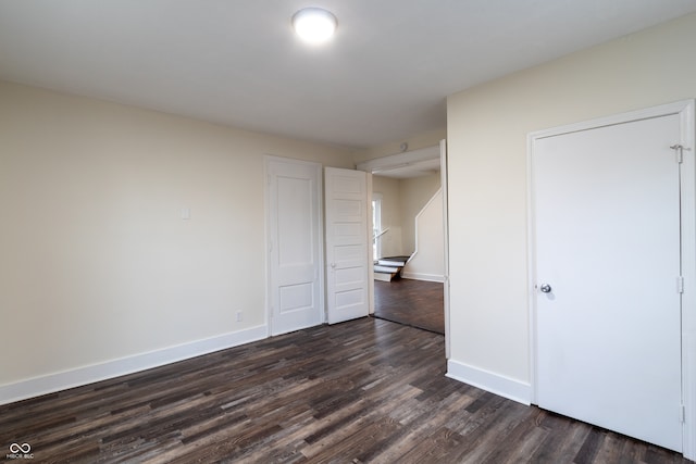 unfurnished bedroom featuring hardwood / wood-style flooring