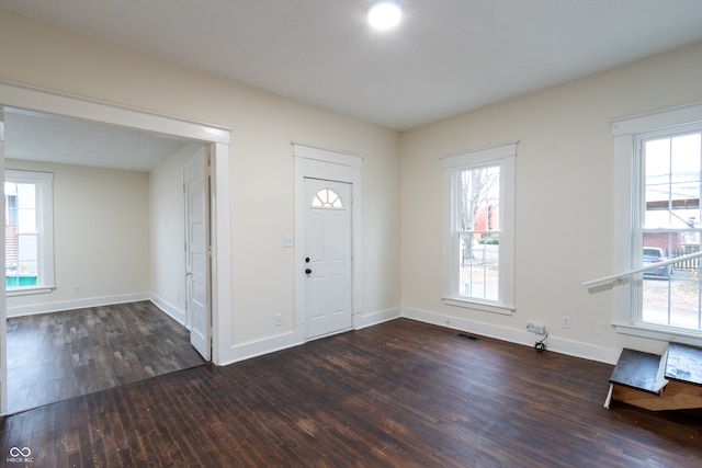 entryway with dark hardwood / wood-style flooring